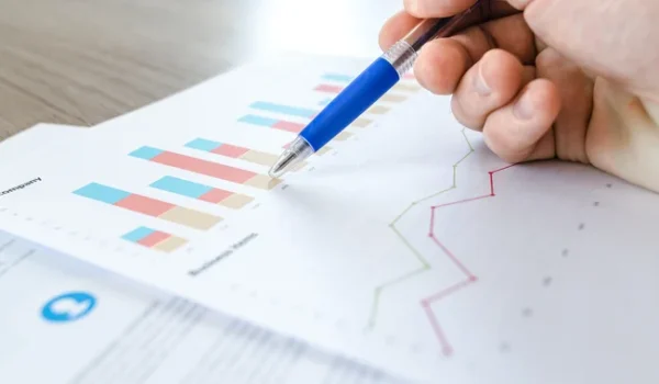 A document with data charts, signifying the data driven approach in lending.