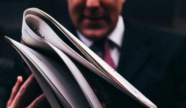 A mortgage lender reading news about the economic shift.