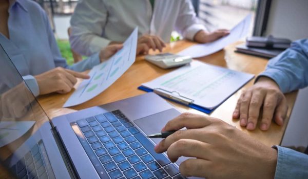 A group of lenders discussing hidden opportunities.